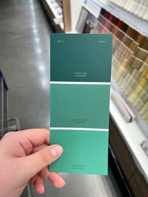 Paint swatch with 3 colors of green 