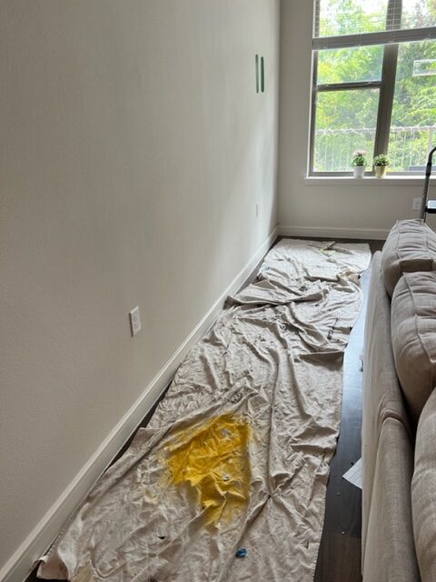 Preparation to paint a wall in living room. 