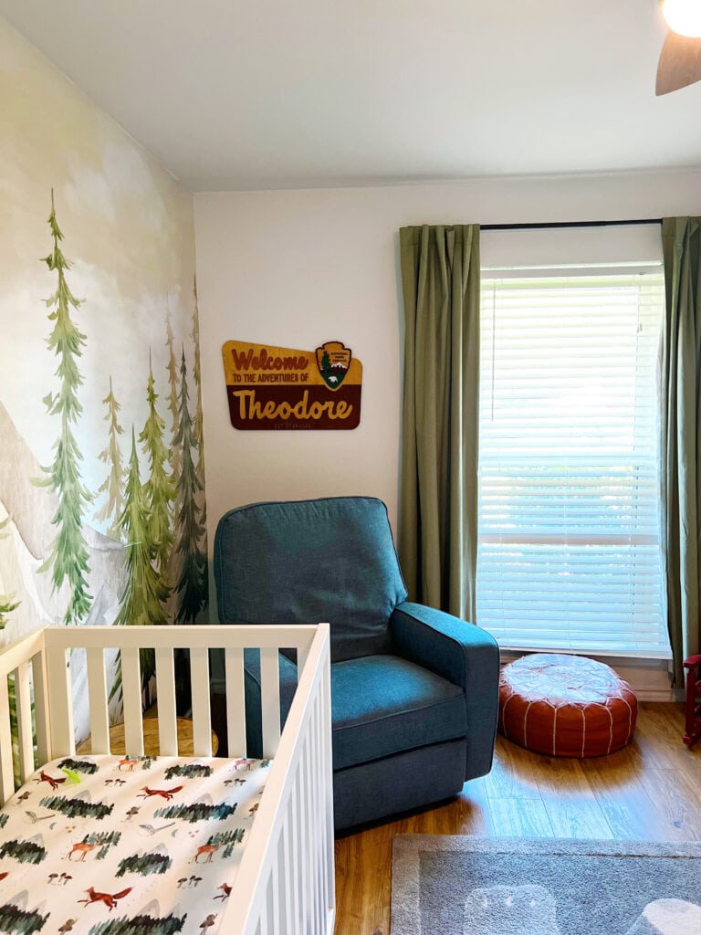 green upholstered rock in a baby boy's room