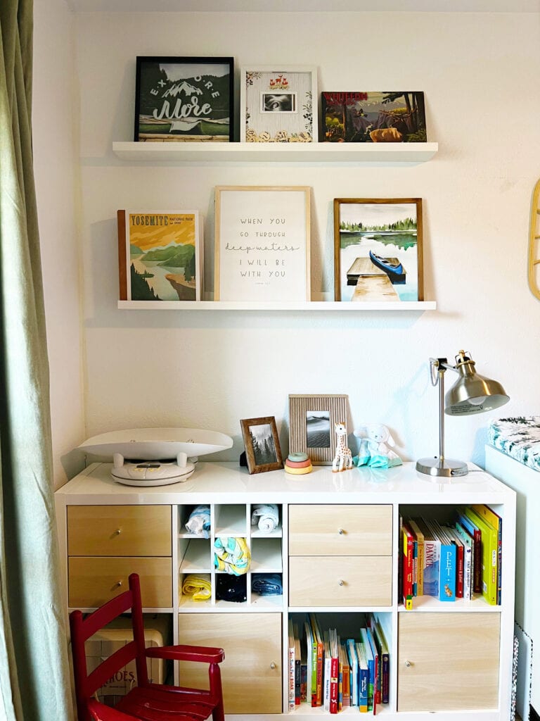 picture ledges above cube shelving for nursery storage