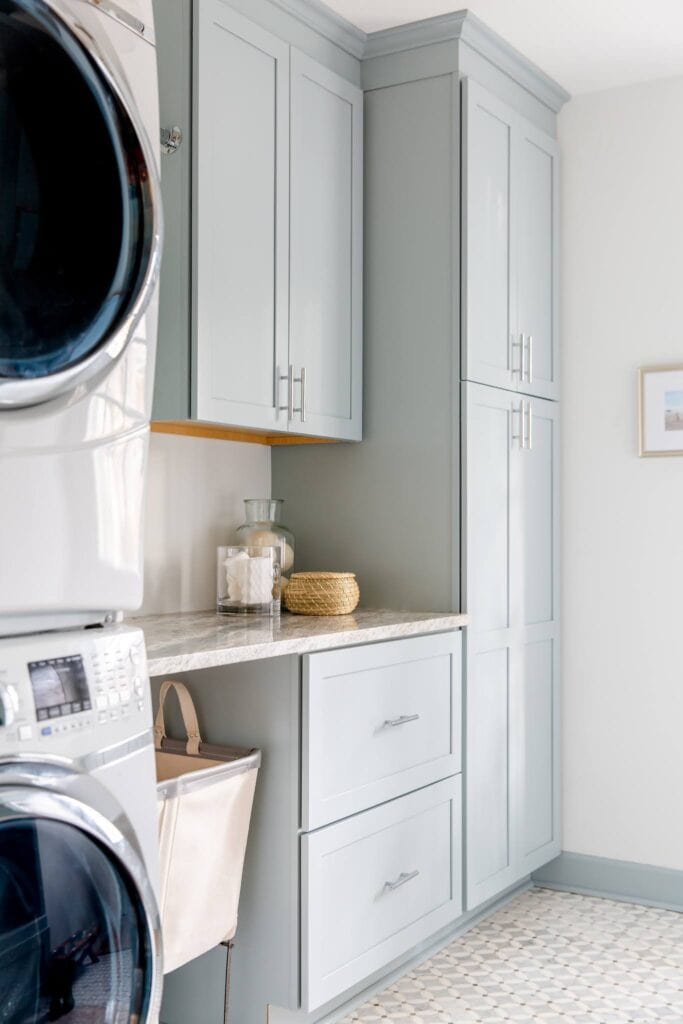 laundry mud room combo with light blue cabinetry 
