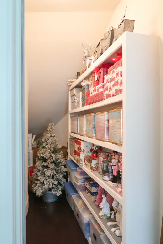 under stair storage closet with seasonal decor inside