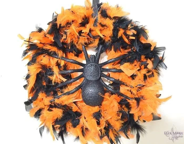 Using an orange and black feathered boa for Halloween wreath ideas.