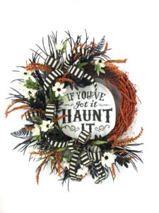 DIY Wreath Design with wood sign that reads, "If You've got it, Haunt it."