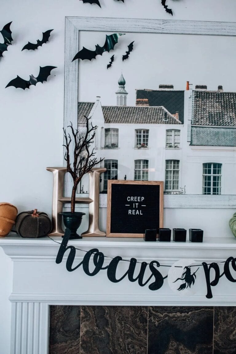 Halloween decor in a home including bats, pumpkins, and a Hocus Pocus banner