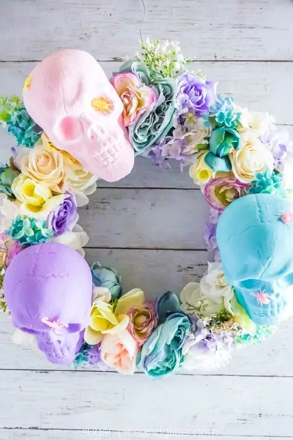 Floral wreath with pastel skulls.