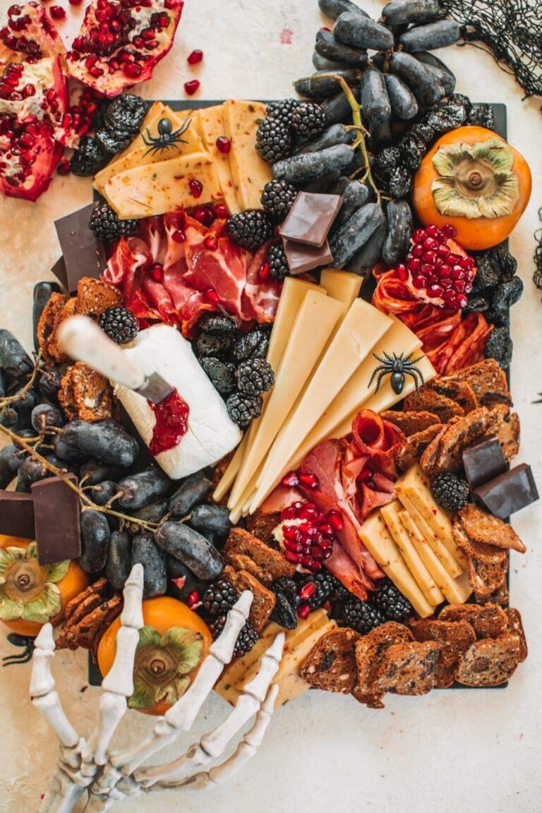 dark red, black and brown tones in a spooky halloween charcuterie board