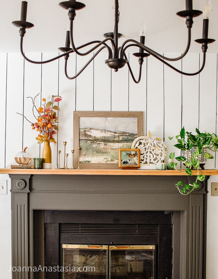 Vintage items displayed above a wood burning fireplace.