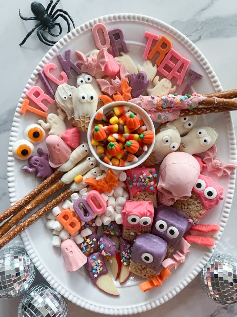 top view of curated pink, purple, and orange candy chacuteries