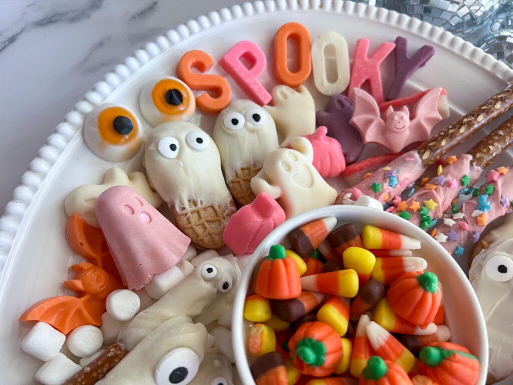 candy letters spelling on SPOOKY on a snack tray