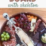 easy + spooky Halloween charcuterie board with skeleton pin