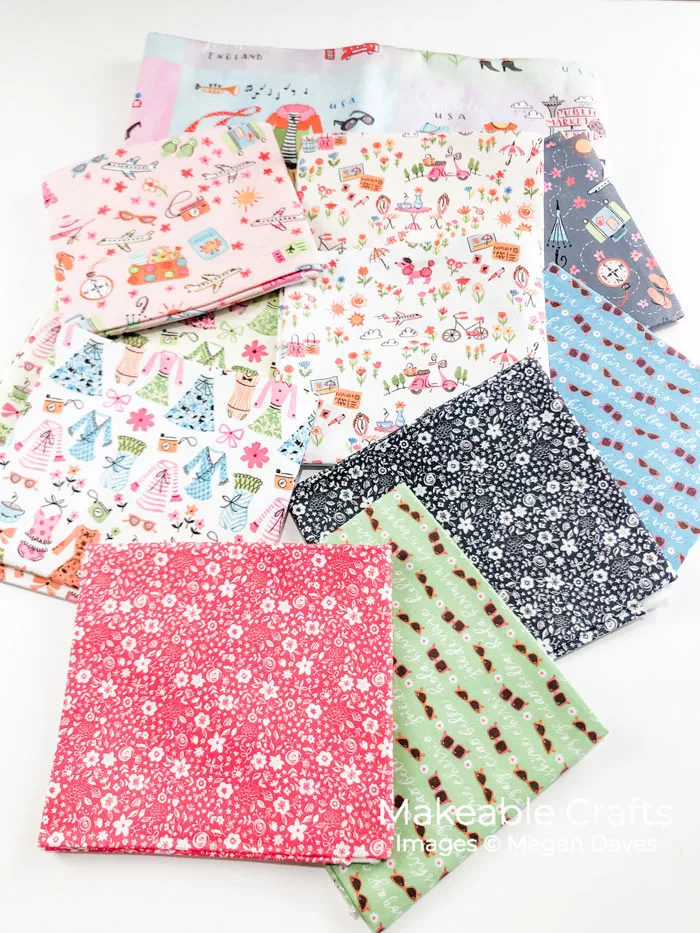 multicolored fabric coasters spread out on a table