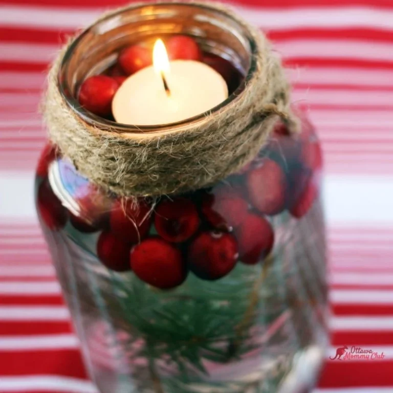 Christmas candle jar with lit tea light inside