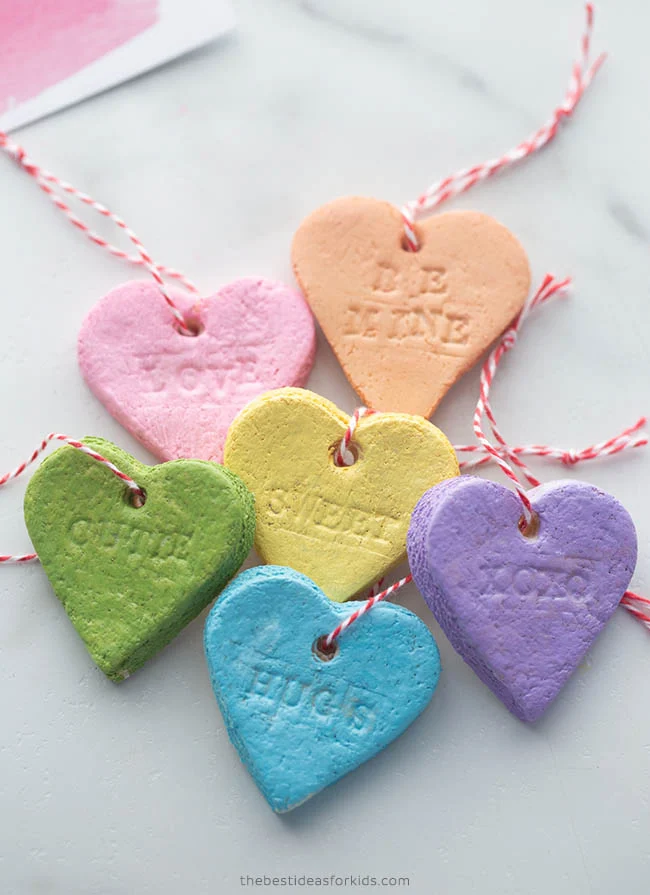 salt dough conversation hearts with red and white string