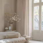Monochromatic cream sitting room with modern accents.