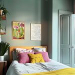 Mint color drenched bedroom with pops of yellow and pink.