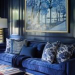 Color drenched navy living room with large art.