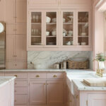 Color drenched pink kitchen with pink walls, pink ceiling, pink cabinets.