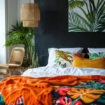 tropical inspired guest room with black accent wall