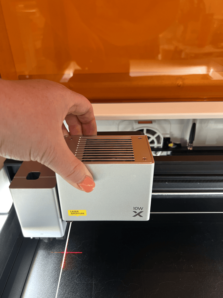 woman adding laser module to M1 Ultra