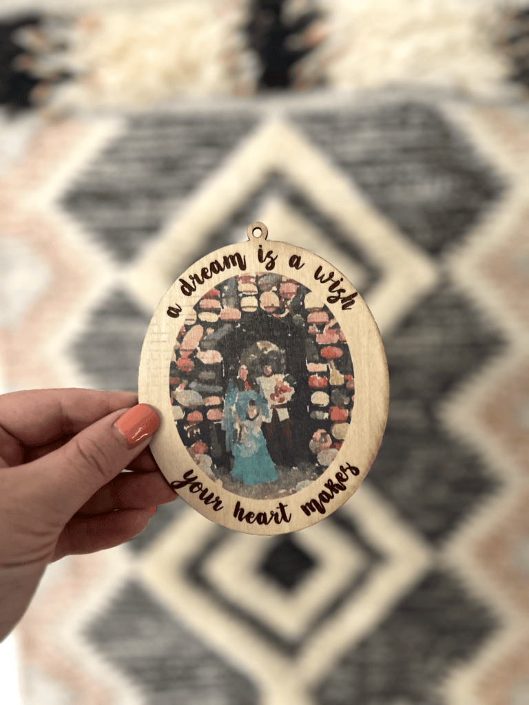 Wooden round with inkjet printed family photo and "a dream is a wish your heart makes" laser engraved using the xTool M1 Ultra.