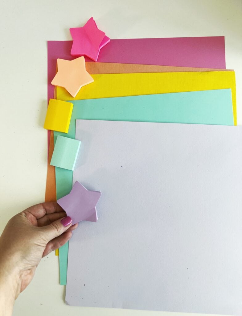 coordinated sticky notes and cardstock paper on a table