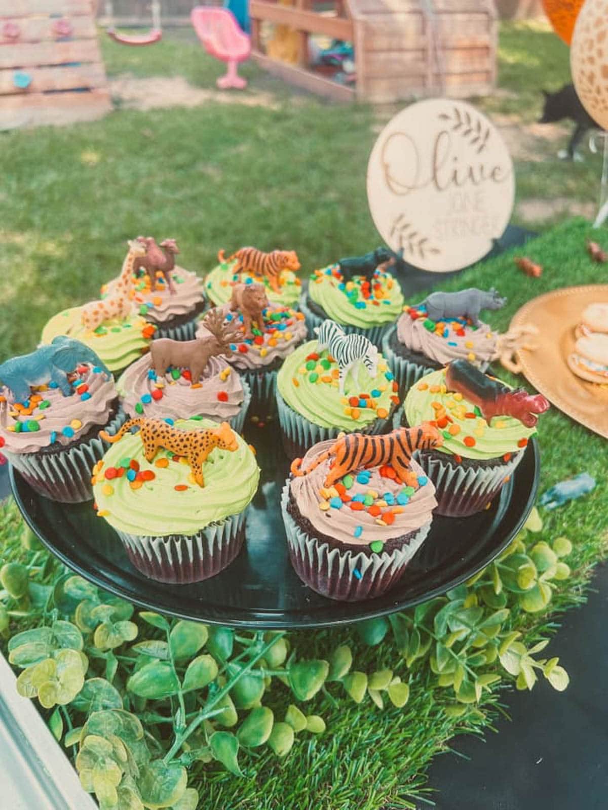 cupcakes with tiny animal figurine toppers
