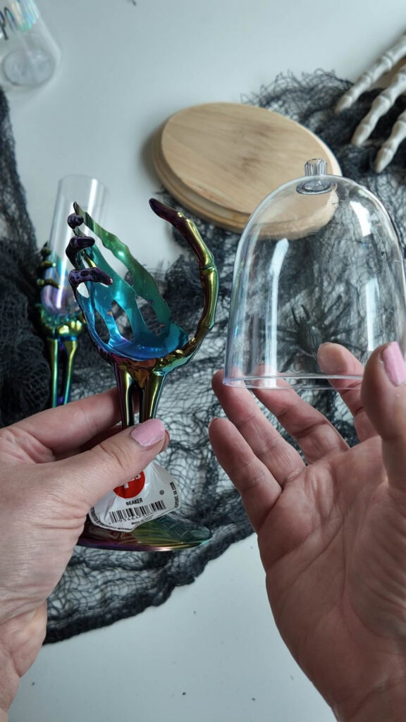 holding up cup after removing from decoration