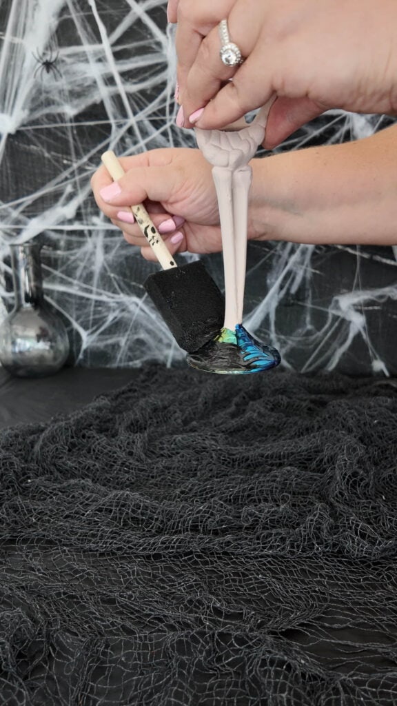 painting cup base with sponge brush