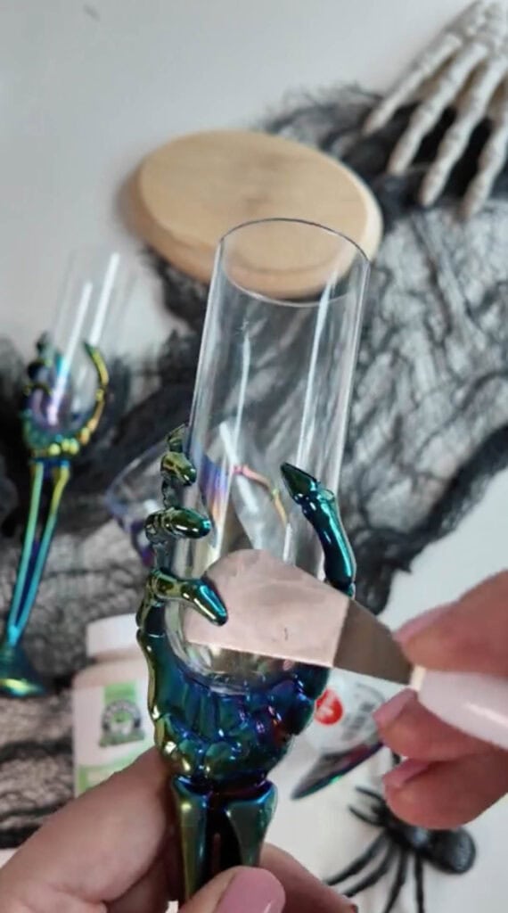 removing cup with a scraping tool