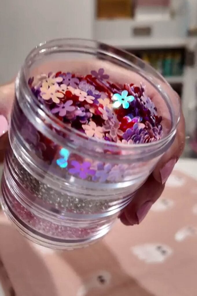 close up jar of flower sequins