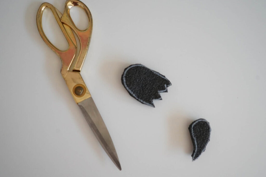 gold scissors next to diy ghost stamps