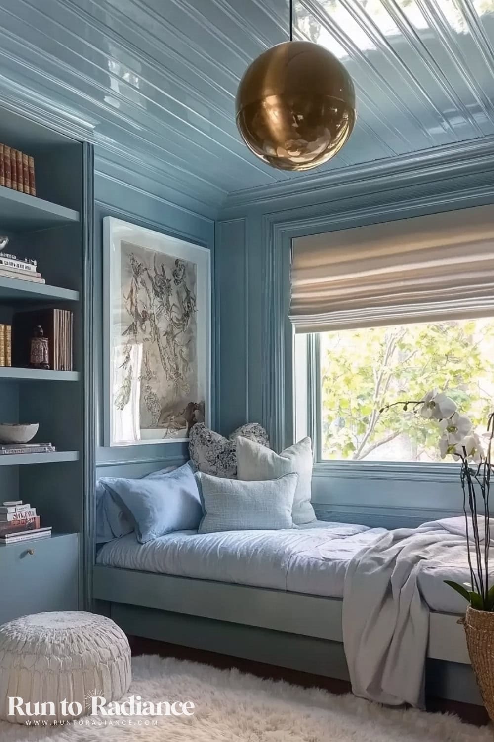 powder blue color drenched bedroom with gold light fixture