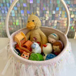 babies easter basket filled with toys