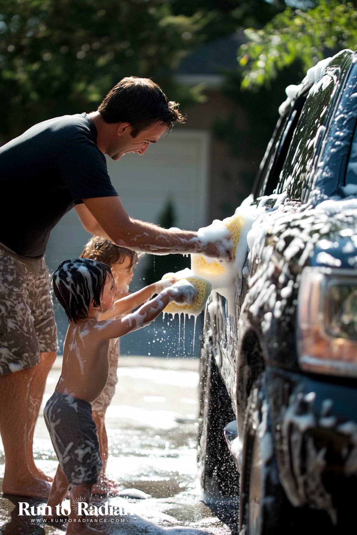 kids washing car with dad