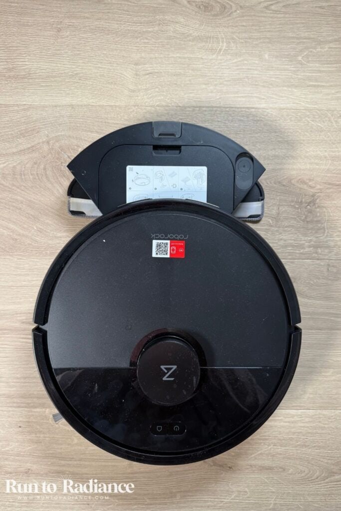 Roborock Q7 L5 robot vacuum with dustbin open.