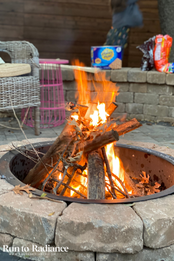 firepit in backyard as a fun summer activity for teenagers
