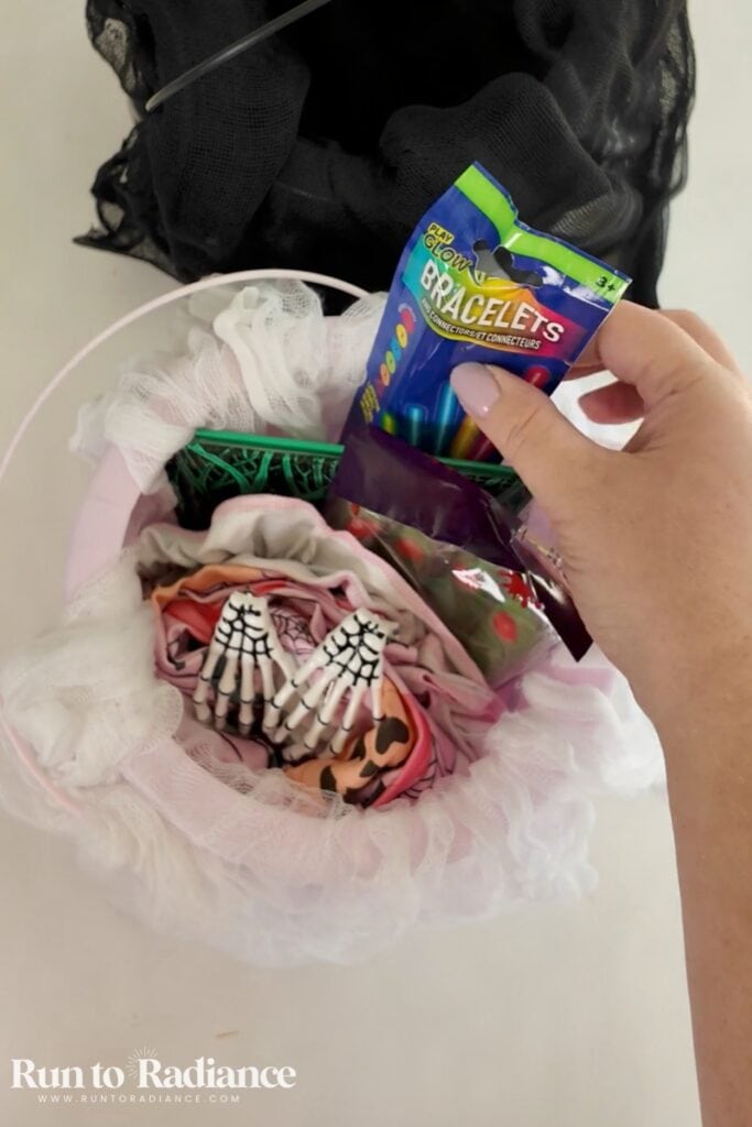 adding glow sticks to a boo basket
