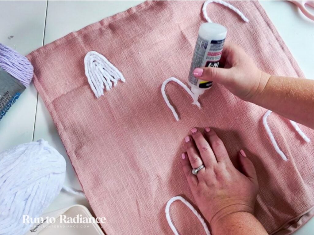 woman making no-sew halloween pillows