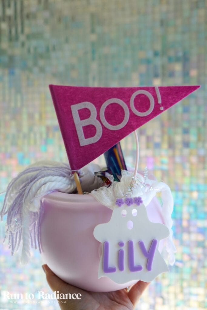 girls pink boo basket with glow sticks, candy, books, and clothes