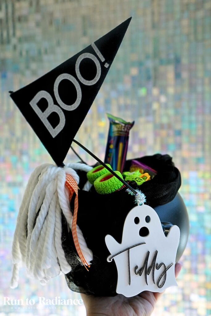 boys boo basket filled with monster truck, glow sticks, candy, and books.