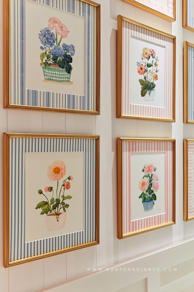 Gallery wall of framed vintage botanical prints with striped mats, cottagecore wall decor