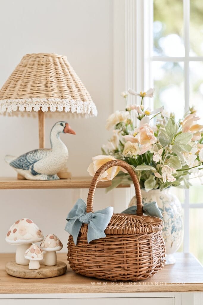 shelf styled in cottagecore aesthetic with a touch of coquette romance - bows, flowers, geese