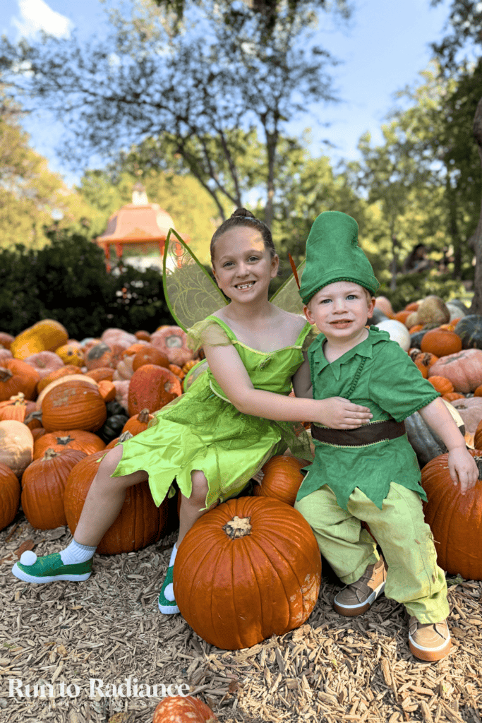 sibling costume idea from peter pan - tink and peter pan in a pumpkin patch
