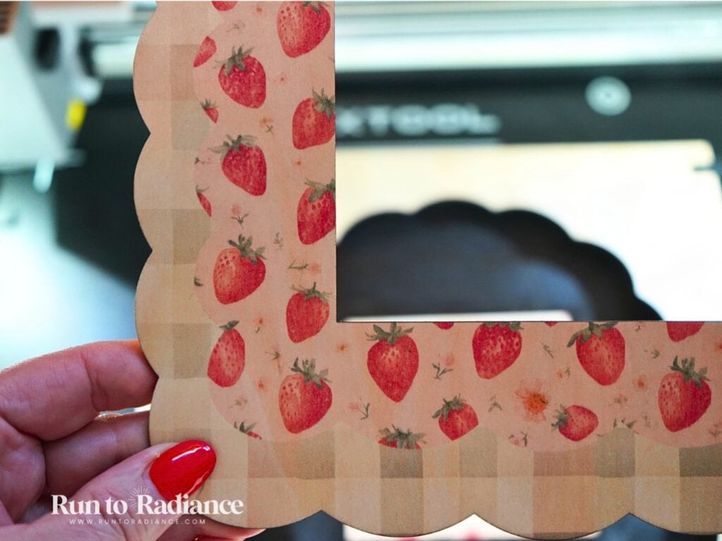 close up of printed photo frame with strawberries and gingham