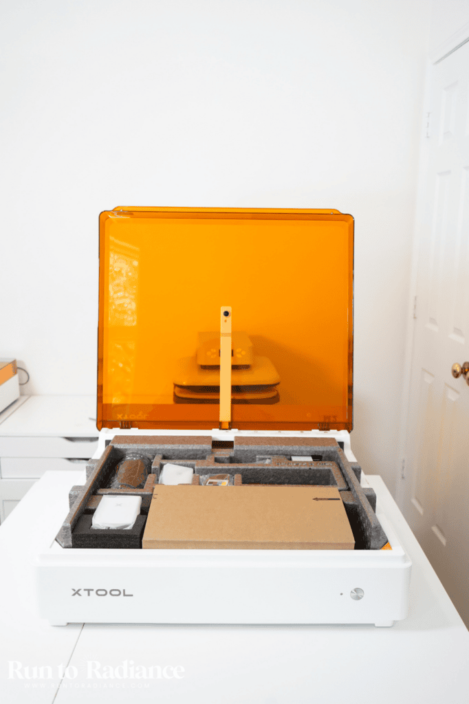 The xTool M2 Color Craft Laser sitting on a craft room table