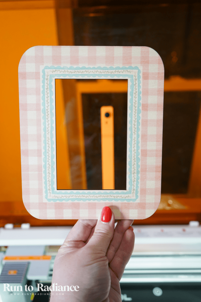 camera in the xtool m2 behind a diy pink gingham switch cover