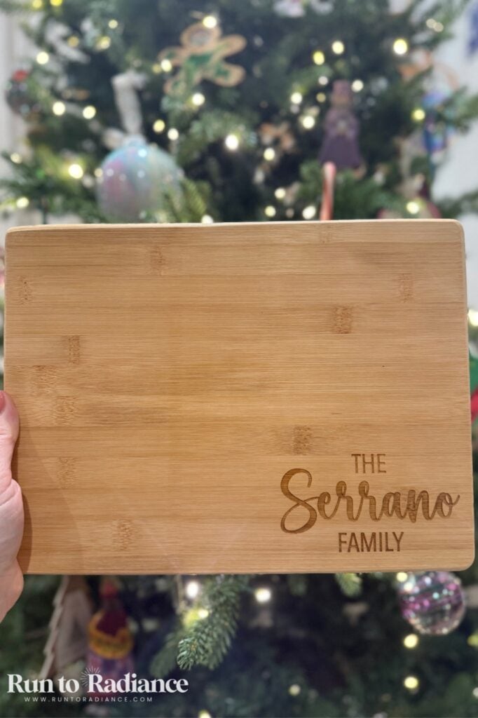 Monogrammed wooden cutting board engraved with the xTool M2