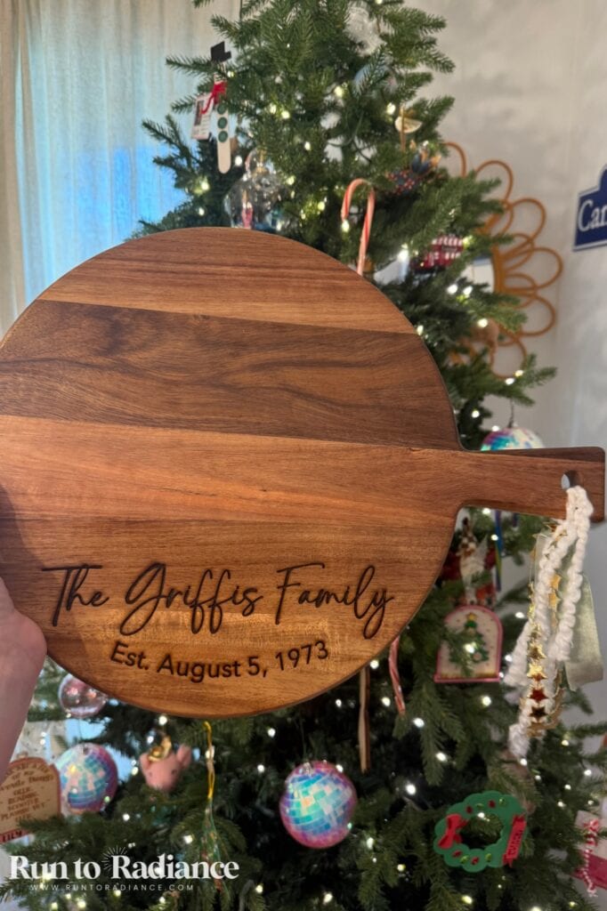 Personalized cutting board engraved with a family name for a Christmas gift