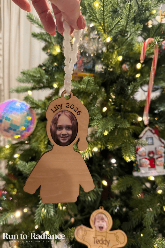 Wooden ugly sweater ornaments with a child’s face printed on top and a blank sweater to paint